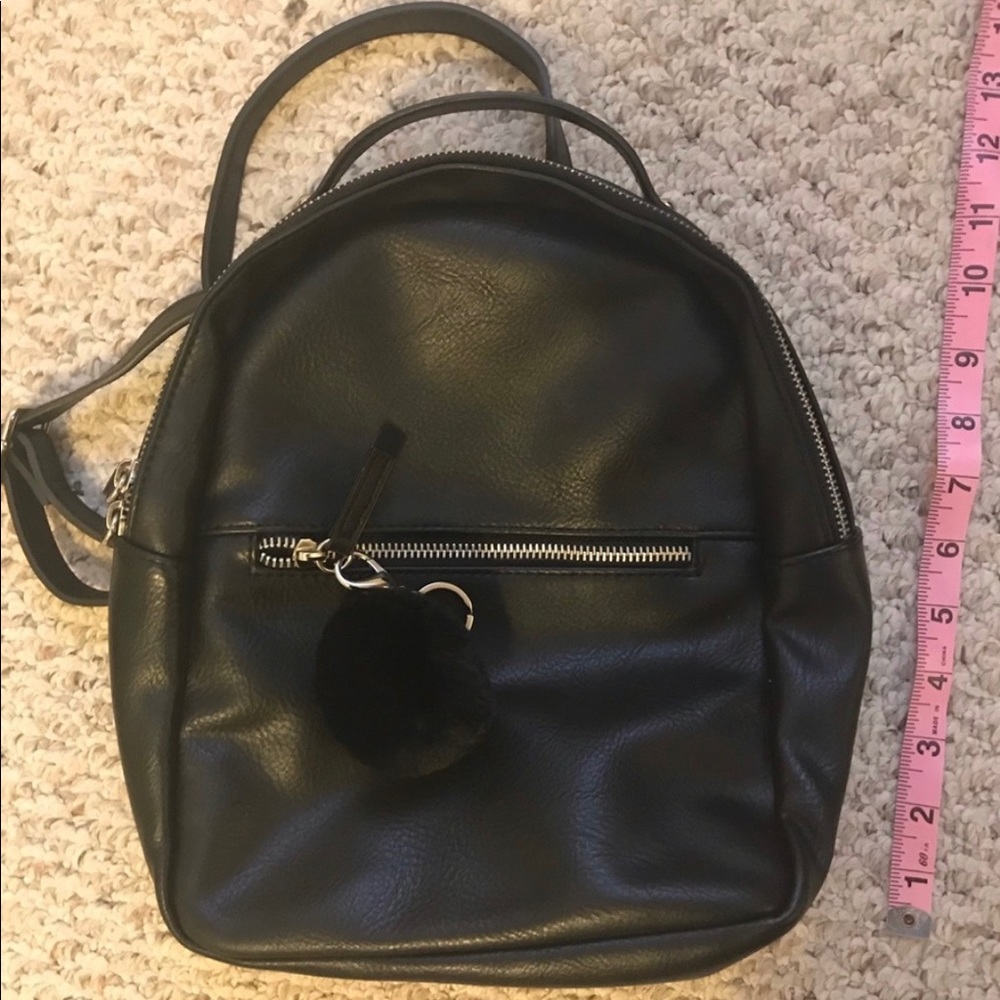 Basic black Pom Pom backpack.